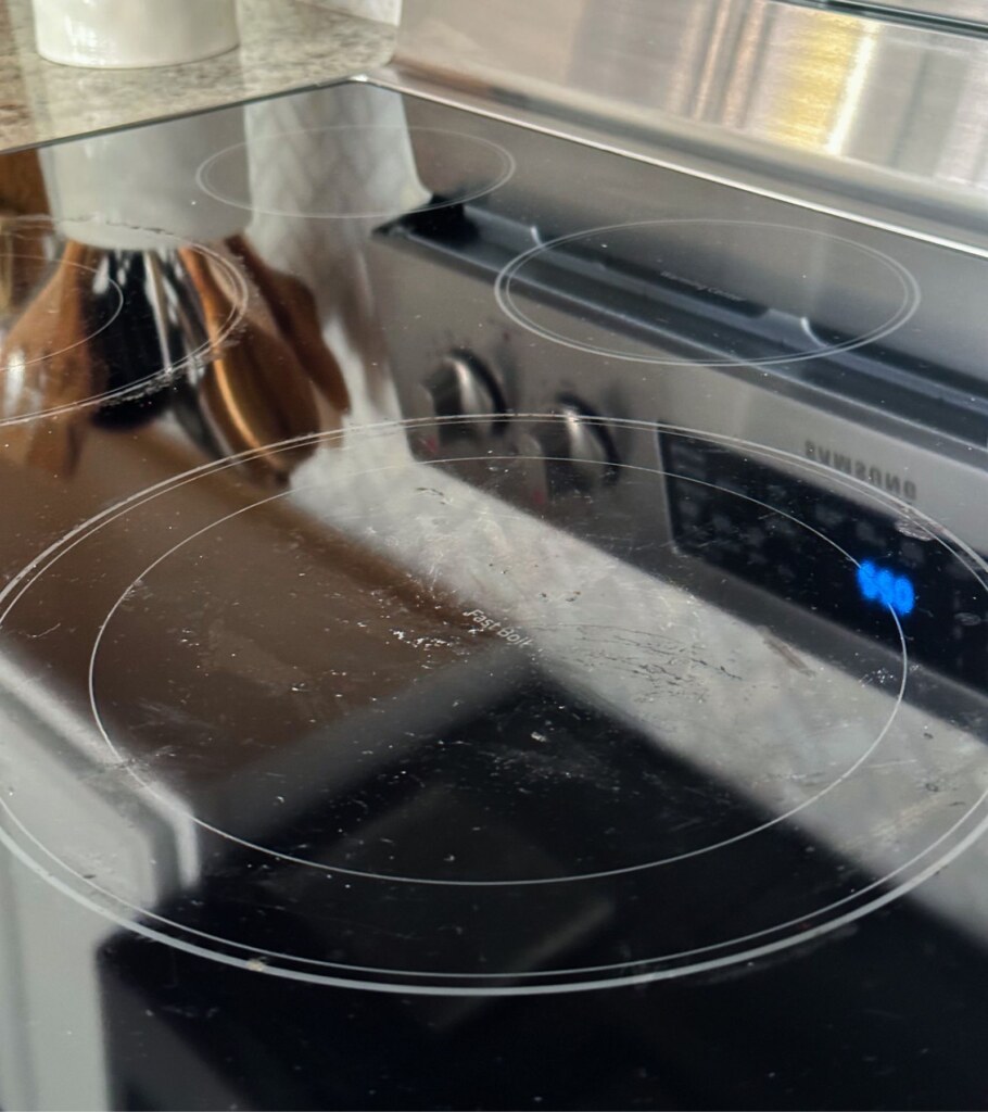 how to clean glass top stove burnt on