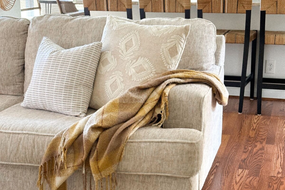 how to drape a throw on a sofa