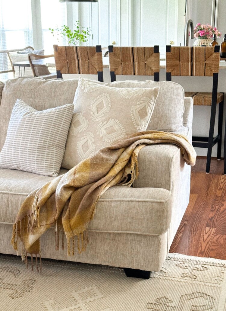 how to drape a throw on a sofa